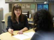 Washington State University Vancouver career counselor Christine Lundeen works with student Annise Nassib at the Student Services Center.