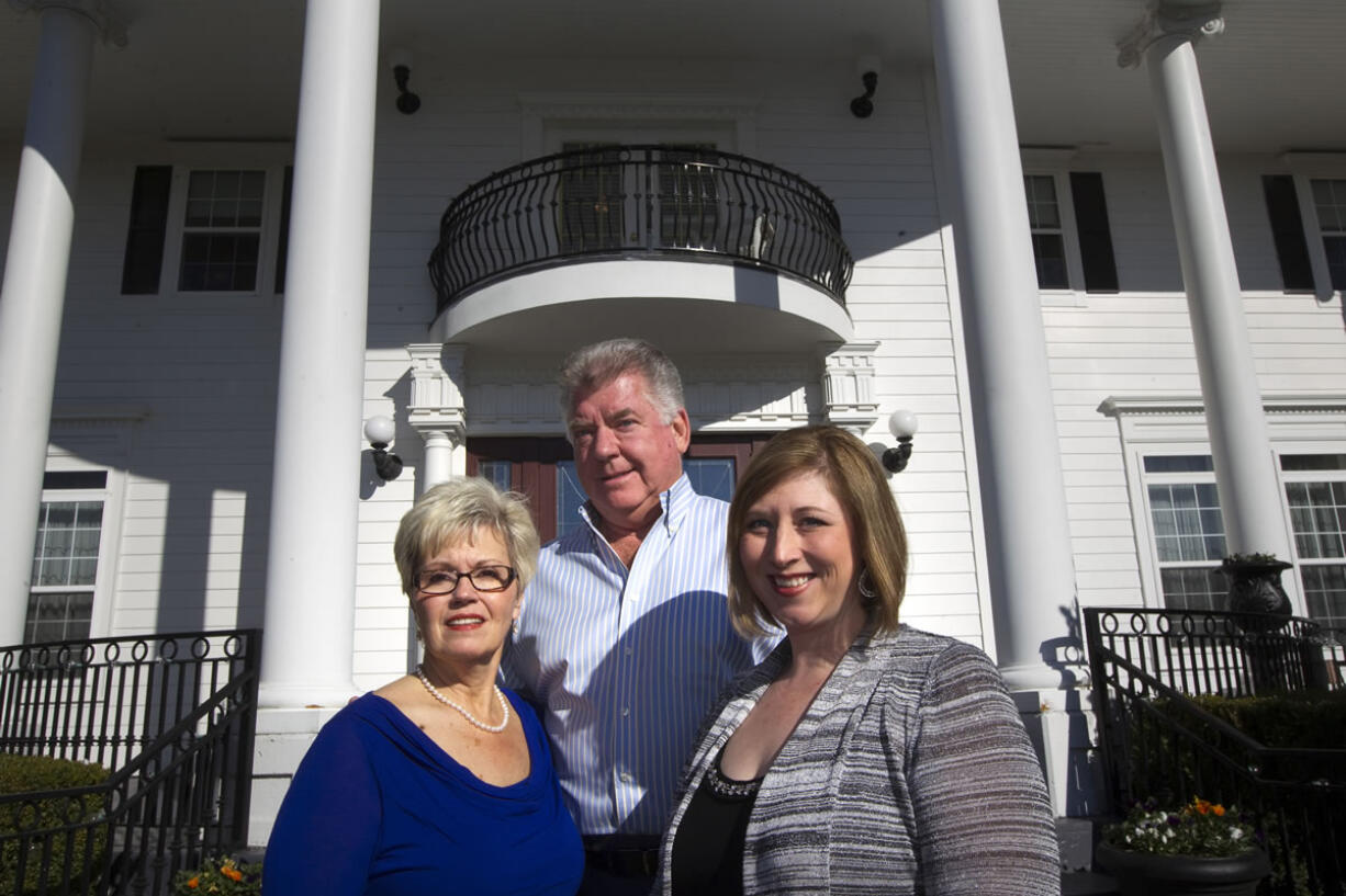 Jennifer Coriell, right, the daughter of Fairgate Inn owners Chris and Jack Foyt, left and center, plans to reopen the Camas venue as an assisted-living facility called Fairgate Estate early next year.