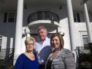 Jennifer Coriell, right, the daughter of Fairgate Inn owners Chris and Jack Foyt, left and center, plans to reopen the Camas venue as an assisted-living facility called Fairgate Estate early next year.