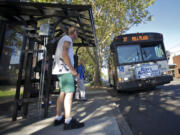 Riders prepare to board the No. 37 bus at Evergreen Boulevard and C Street in Vancouver this week. C-Tran plans to tweak several routes starting Sept. 15. Some fares will increase Sept.