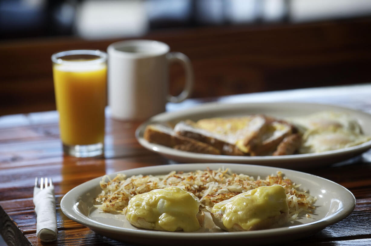 Eggs Benedict with hashbrowns and French toast  with two eggs and sausage at Old Town Burger &amp; Breakfast in Battle Ground.