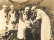 Nurses wear gas masks in Germany during World War I.