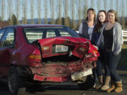 Karen Munger, left, is searching for clues about a hit-and-run driver who crashed into a 1995 Honda Civic driven by her daughter, LaKell Munger, right, 16, injuring her passenger, Ruchelle Shamp, 17, center.