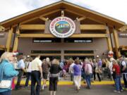 Customers enter Chuck's Produce &amp; Street Market after a ribbon cutting ceremony this morning celebrating its new Salmon Creek store.