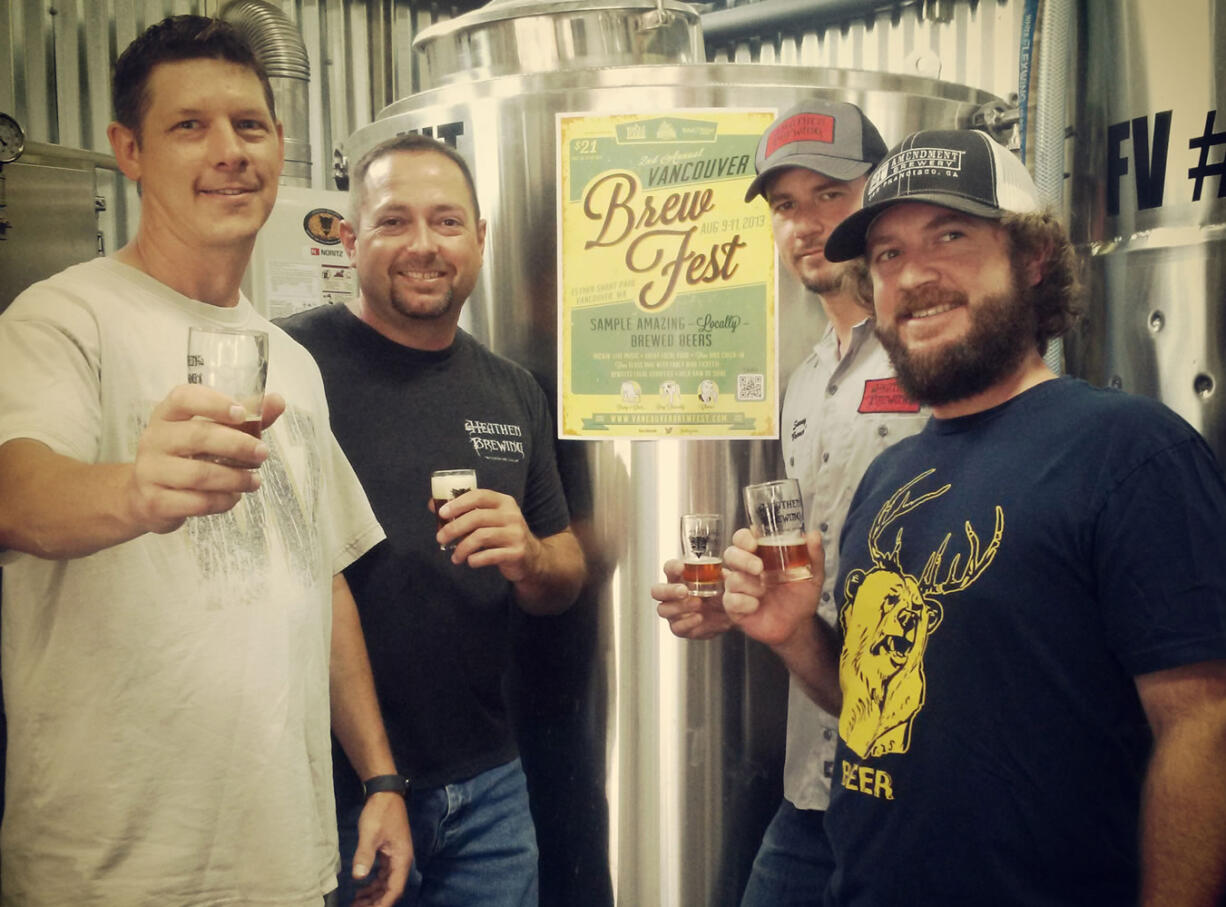 Andy Stromberg and Cody Gray of the Vancouver Brewfest, Sunny Parsons of Heathen Brewing and Matt Corson of Total Wine &amp; More, left to right, toast the launch of the first official festival beer at Heathen's brewery in Vancouver.