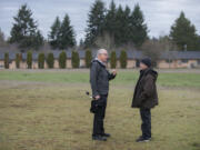 Bill Ritchie, chairman of the Clark County Commission on Aging, left, chats Thursday with Adam Kravitz, future site manager of the village for the homeless that will be built in a field at Safe Harbor Church of the Nazarene in Vancouver.