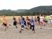 Woodland: Racers run to raise money for the Clark County Food Bank during the Race Against Hunger event held July 27 at Holland America Bulb Farms in Woodland.