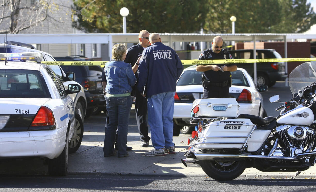 The Deseret News
West Valley City police officers investigate an officer-involved shooting on Friday, Nov. 2, 2012.  Danielle Willard of Vancouver died at the scene.