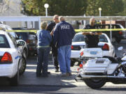 The Deseret News
West Valley City police officers investigate an officer-involved shooting on Friday, Nov. 2, 2012.  Danielle Willard of Vancouver died at the scene.