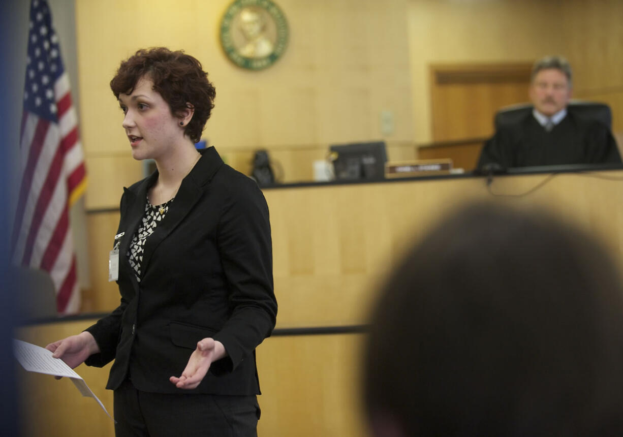 Ridgefield High School senior Phoebe Askelson delivers an opening statement in a mock domestic terrorism trial.