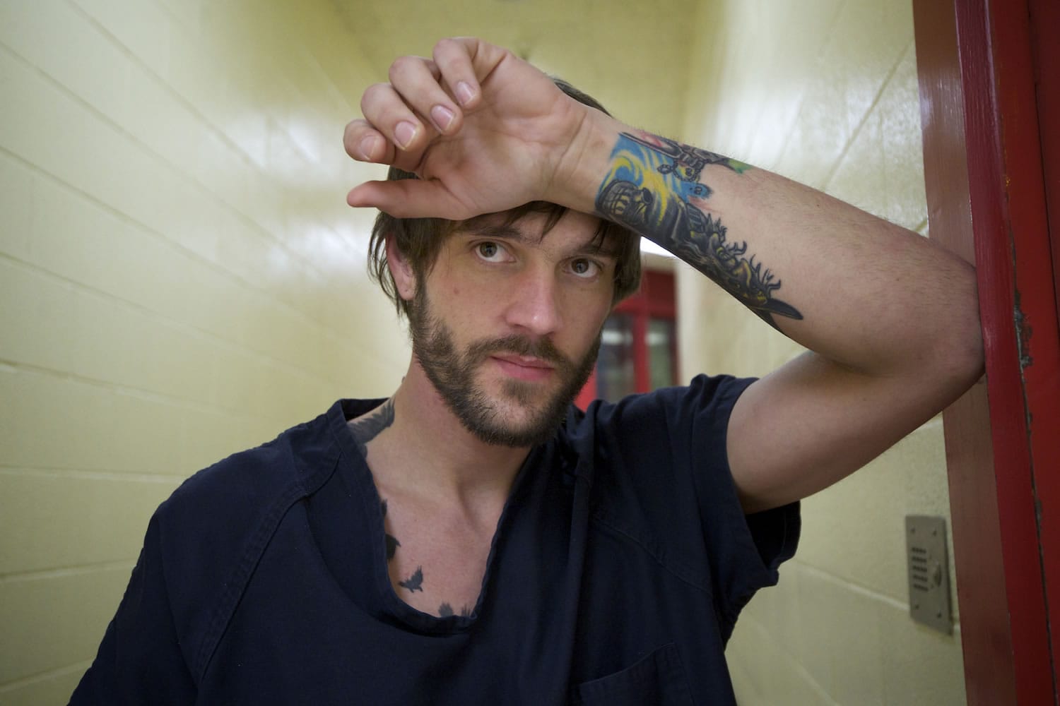 Travis Trenda waits for instructions from a custody officer at the Clark County Jail.