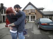 Travis Trenda and Mandy Cooper embrace as they reunite outside Grace Lodge, a home for recovering drug addicts. The couple spent a few hours together, eating dinner and with Mandy giving Travis a haircut.