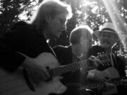 Doug Smith, from left, Terry Robb and Mark Hanson will perform as Acoustic Guitar Summit during their 18th annual holiday concert Dec.