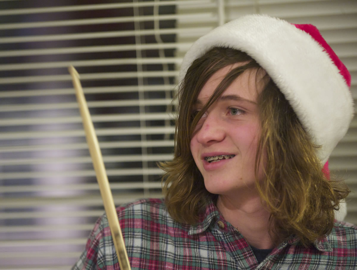 Hunter Maxson, a student at the Opus School of Music in Ridgefield, plays the drums during a rehearsal for a gig at the Holiday Gift Fair.