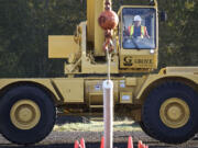 Clark County's Stever Frein takes part in the &quot;Stand and Move Pipe&quot; event during the Crane Operator Rodeo on Oct.