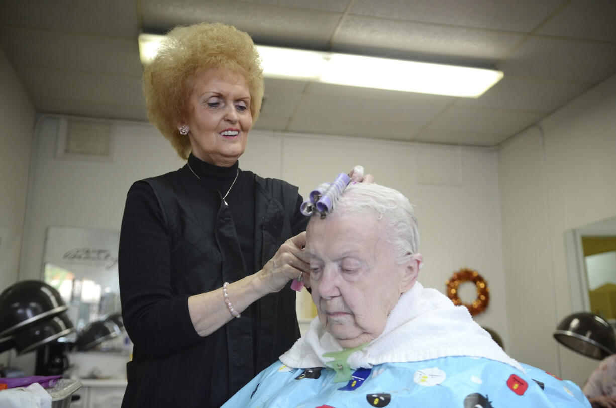 Shari Lahmann, longtime Vancouver hairstylist and owner of The Fashionette, sets Iva Dell's freshly shampooed hair in curlers, the second step in a start-to-finish hairstyling process that can take anywhere from one hour to three hours.