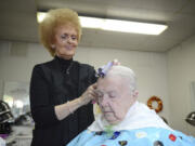 Shari Lahmann, longtime Vancouver hairstylist and owner of The Fashionette, sets Iva Dell's freshly shampooed hair in curlers, the second step in a start-to-finish hairstyling process that can take anywhere from one hour to three hours.