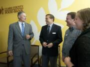 Gov. Jay Inslee visits the Clark County Food Bank on Monday in Vancouver for an informal breakfast meeting with numerous local nonprofit groups.