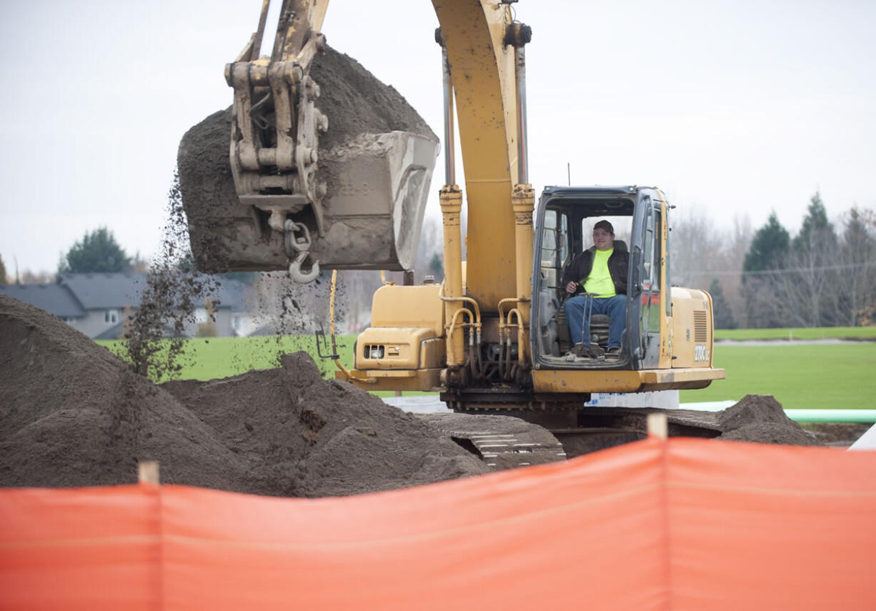 Construction is in progress at Pleasant View Estates, a housing development on Northwest McCann Road. The 169-lot subdivision is one of many housing projects that are part of a new construction boom in Clark County.