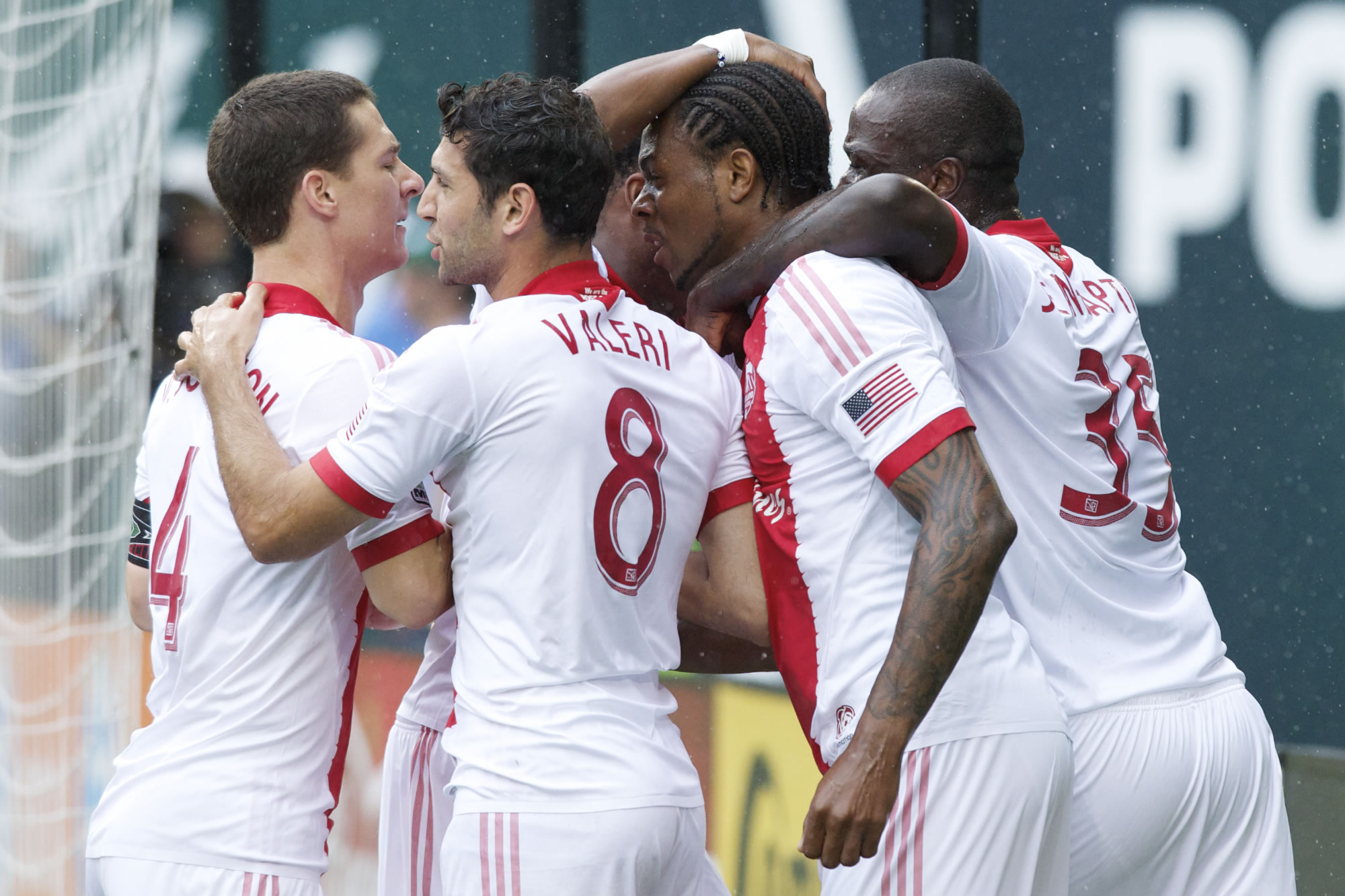 Portland Timbers Frederic Piquionne is congratulated by teammates after scoring the game's first goal.