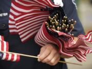 Firefighters planted 304 flags at the Hockinson station.