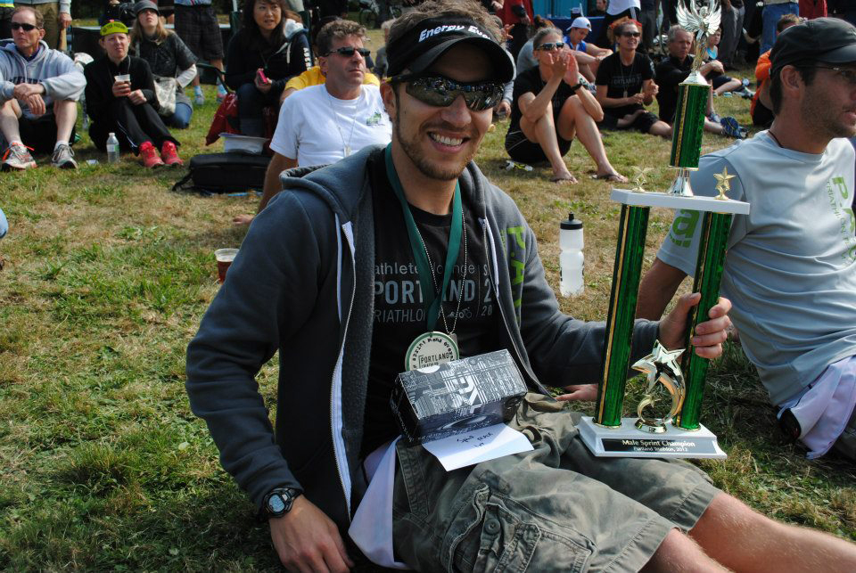 Vancouver's Josh Monda shows off his hardware for winning the Portland Triathlon sprint distance race on Saturday.