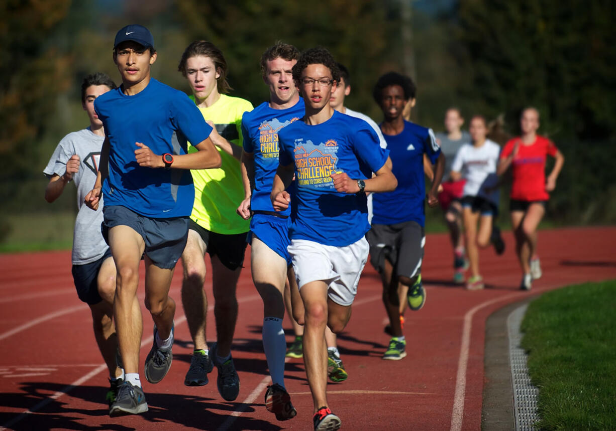 Union cross country standout Said Guermali, front left, works out with teammates on Monday.