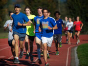 Union cross country standout Said Guermali, front left, works out with teammates on Monday.