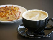 A bacon and cheese bagel and a vanilla honey latte are two of the treats available at Fairway Coffee, in the WinCo shopping center along Highway 503.