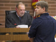 Vancouver police Detective Jeremy Free, right, pleaded guilty Thursday in Camas-Washougal Municipal Court to obstructing law enforcement.