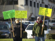 On Jan. 17, former and present case managers for the Southwest Washington Agency on Aging and Disabilities, including Skyler Dorsey-Schlenker, left, and David Benedicktus, picketed outside the agency office in Hazel Dell.