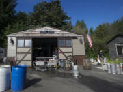 Heathen co-owner and brewer Sunny Parsons prepares to wash kegs.