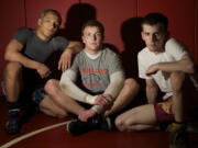 Prairie wrestlers (from left) Mario Gonzalez, Tyler Duncan and Wil Treadwell each have their unique story about how they reached state.