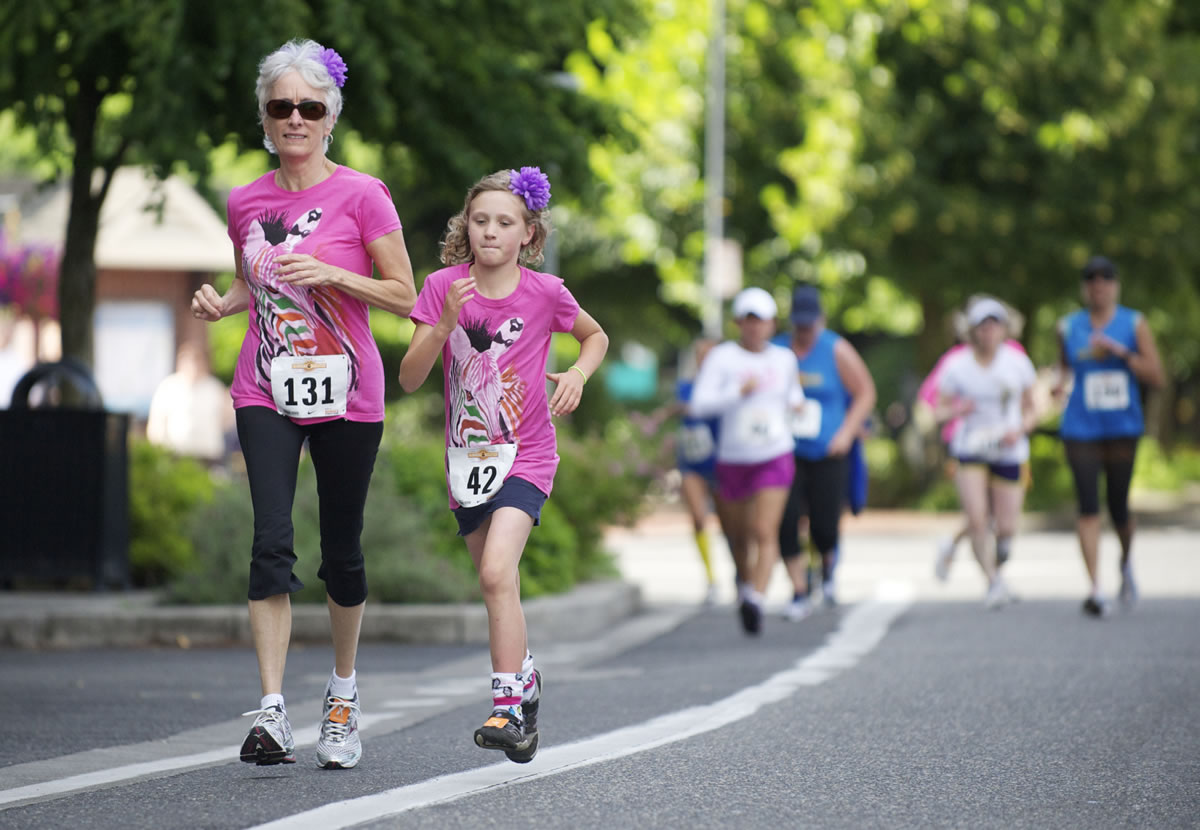 Jody Richter (131) and 9-year-old Eris Delay (42) make their way along the Summer Solstice course on Saturday.