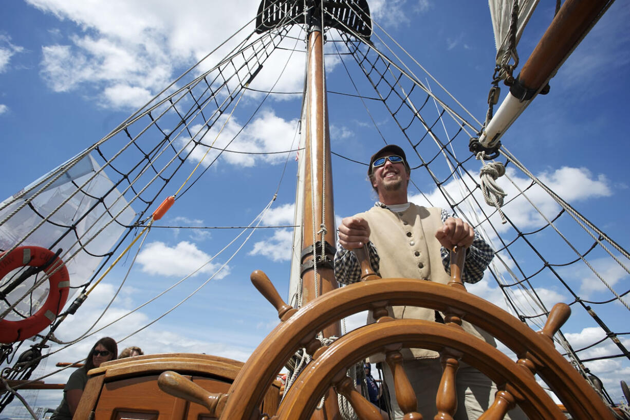 Chief Mate Kent Gorham takes the wheel of the Hawaiian Chieftain.