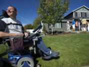 Brian Epp, 42, relishes the sight of his newly renovated home at an open house he and his wife, Jennie, held Saturday to show of the fruit of volunteer hours and donated money for a home makeover to make the family's home wheelchair-accessible.