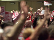 With applause or booing not allowed, advocates raised their hands in agreement or gave thumbs down in disapproval during a Wednesday public hearing on a proposed coal export facility in Washington.