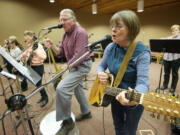 Terri Clark, right, and Bobby Clark perform spiritual songs during a rehearsal last week at St.