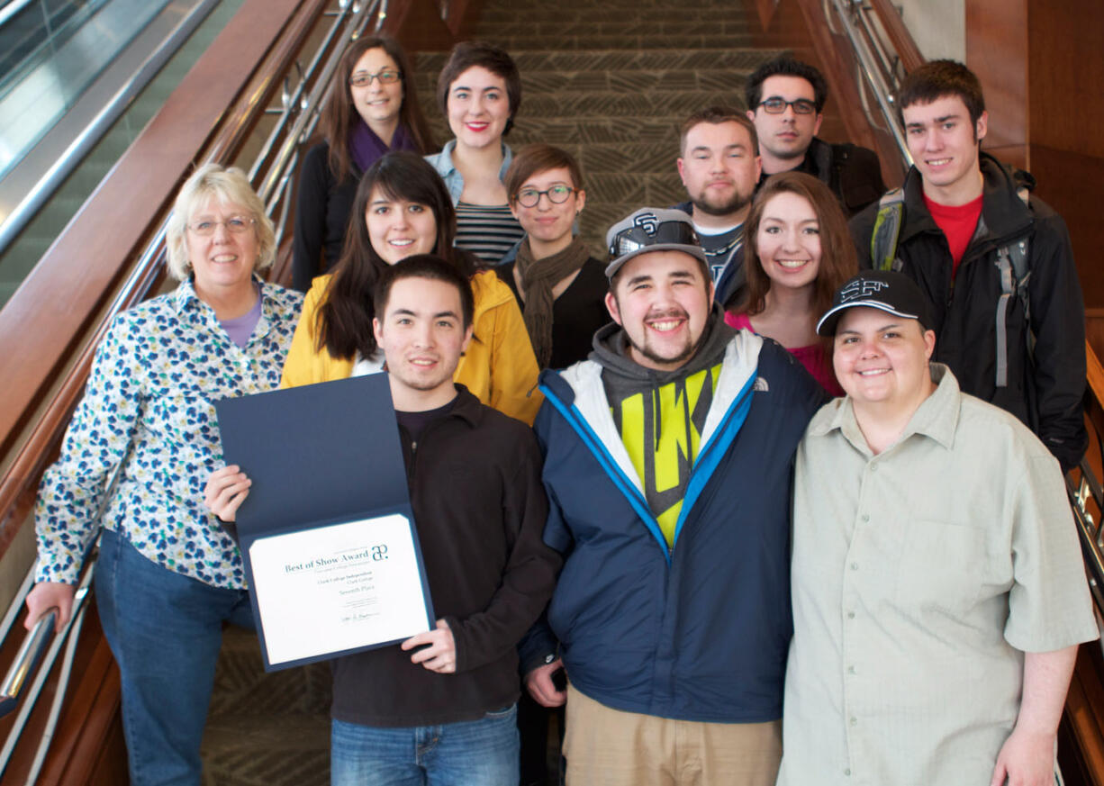 Central Park: Kyle Yasumiishi, editor-in-chief of Clark College's student newspaper the Independent, holds an award he and his staff, pictured, brought back from a journalism conference in San Francisco early this month.