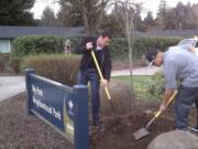 Maplewood: Shooting victim Jose Reyes, right, helps Mayor Tim Leavitt plant a tree in Mypark on March 15.