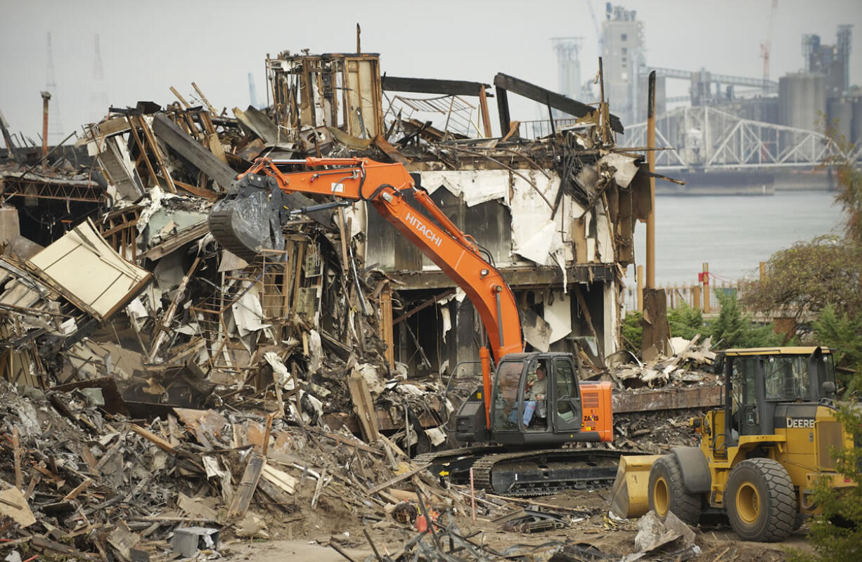 Cleanup is under way Wednesday at the site of the Sept. 2 five-alarm fire at the Thunderbird On The River hotel.