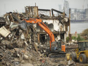 Cleanup is under way Wednesday at the site of the Sept. 2 five-alarm fire at the Thunderbird On The River hotel.