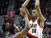 Portland Trail Blazers forward Nicolas Batum (88) looks to pass inside against Philadelphia's Evan Turner.