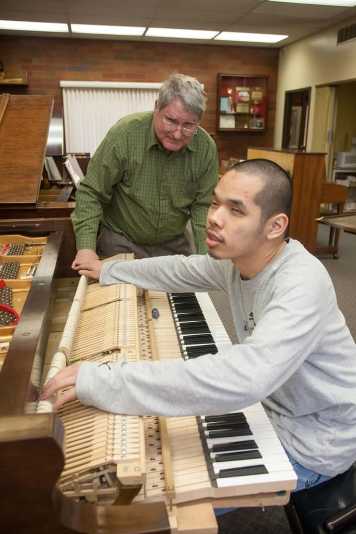 Instructor Don Mitchell works with Piano Hospital student Andrew Park.