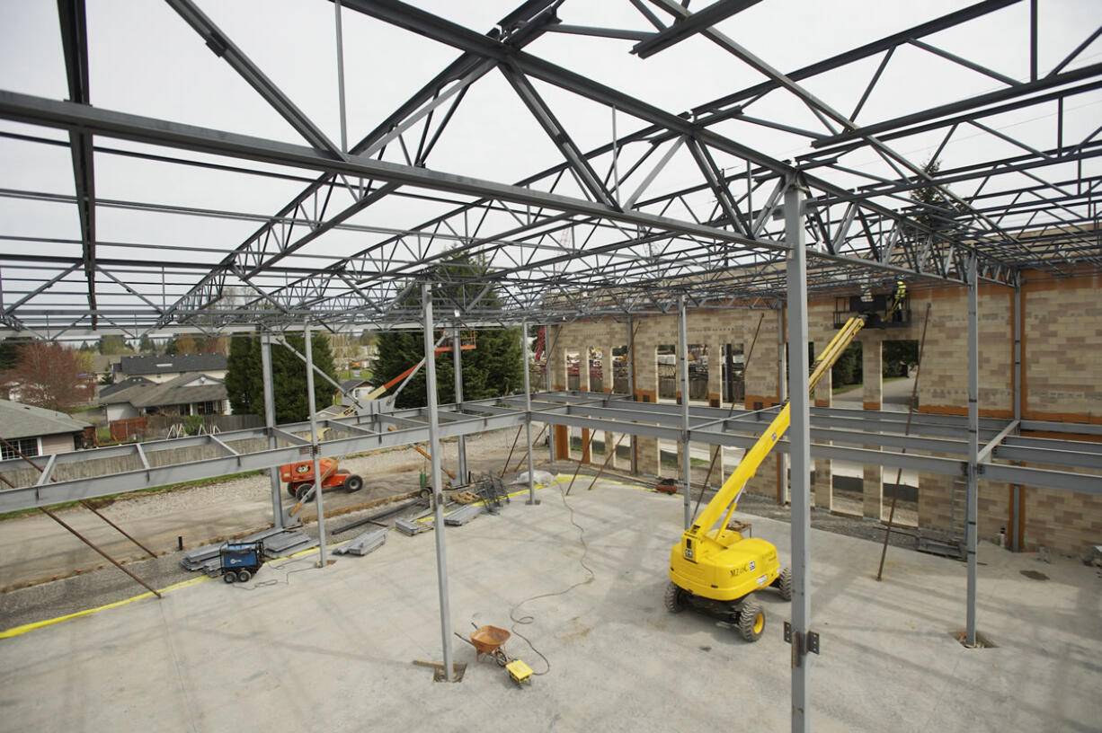 An overhead view of the 30,000-square-foot Salmon Creek Medical Plaza reveals masonry walls on a concrete slab with steel framing for its second-story metal deck and roof under construction at Northeast 139th Street and 10th Avenue.