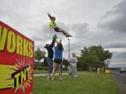 Maleigha Williams, 8, comes down for a basket catch from Katy Griffee, 15, center, and Jennifer Foster, left, with observer Connor Foster, 9, right, on Sunday.