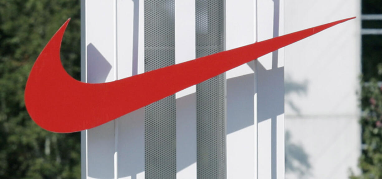 The red Nike swoosh marks the entrance to the company's headquarters campus in Beaverton, Ore.