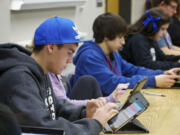 La Center High School student Alex Firl, 15, takes an assessment exam in Spanish class using an iPad Friday.