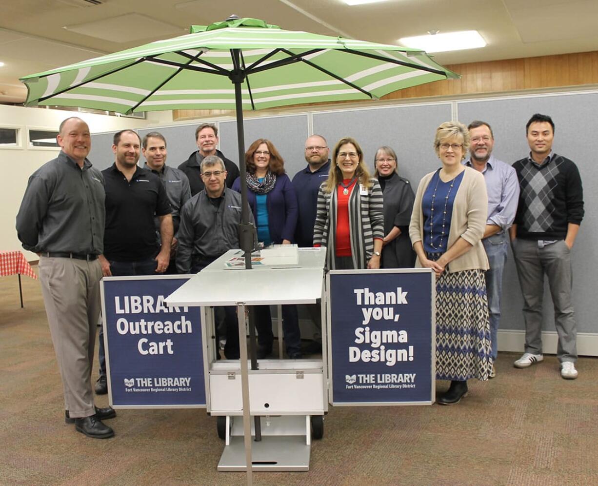 Hudson&#039;s Bay: Representatives from Sigma Design with Fort Vancouver Regional Library District employees, from left: Jay Tucker, Pat Scranton, John Provost, Mark Schoening and Kevin Carbone, of Sigma Design, Janet Alder, Fort Vancouver Library, Luke Jones, Sigma Design, Sue Vanlaanen, Amelia Shelley and Jeanne Heikkinen, of the library district, and Bill Huseby and Dean Van, Sigma Design.