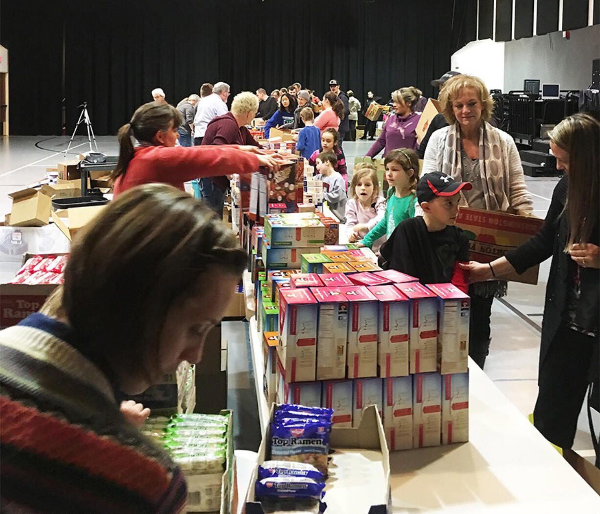 East Vancouver: Volunteers from the Evergreen School District Foundation Pantry and Life Point Church packed up nearly 350 boxes of food for students in need to take home over winter break.